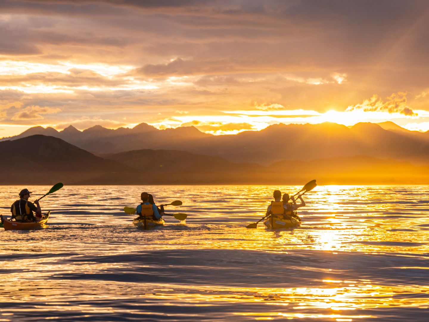 Visitors Paddling On A Stunning Sunset Kayak Tour In The South Island | Kaikoura Kayaks